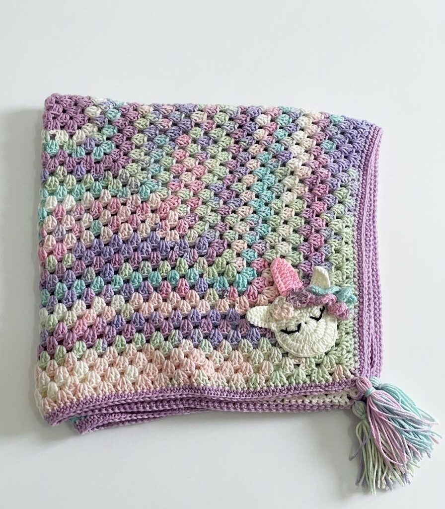 WhatsApp Image 2026-04-17 at 11.02.17 AM (2) Handmade Pastel Crochet Baby Blanket with Unicorn Design & Tassel – Soft & Unique